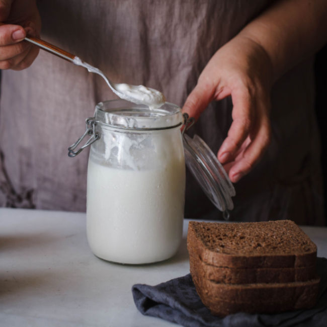 kefir in jar besides slices of toast