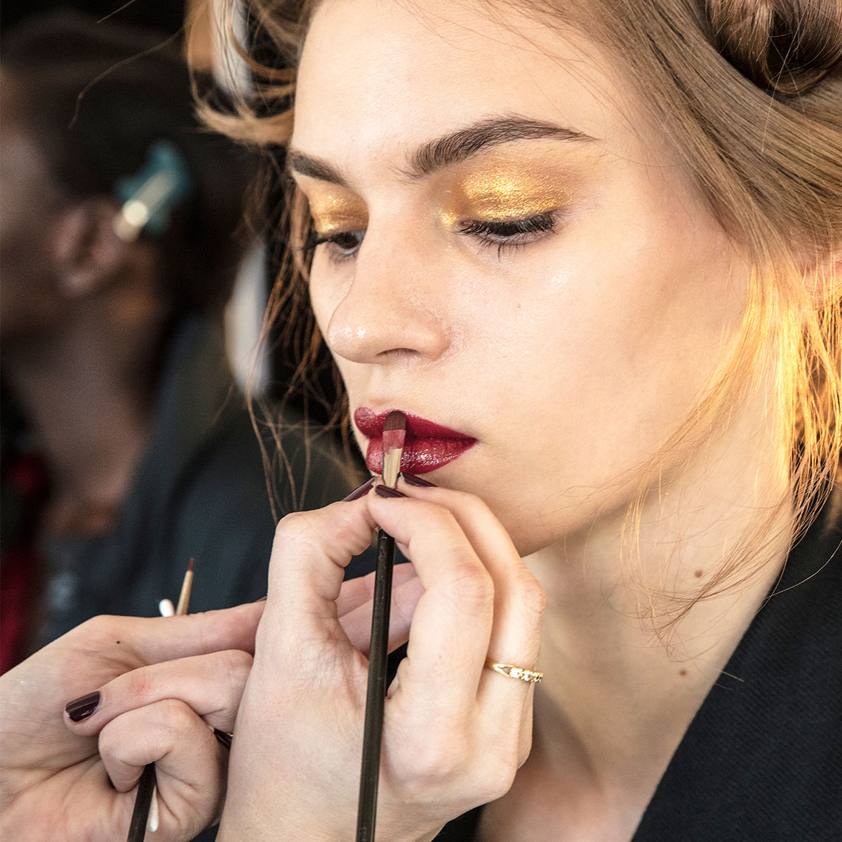 makeup-artist-applying-lipstick