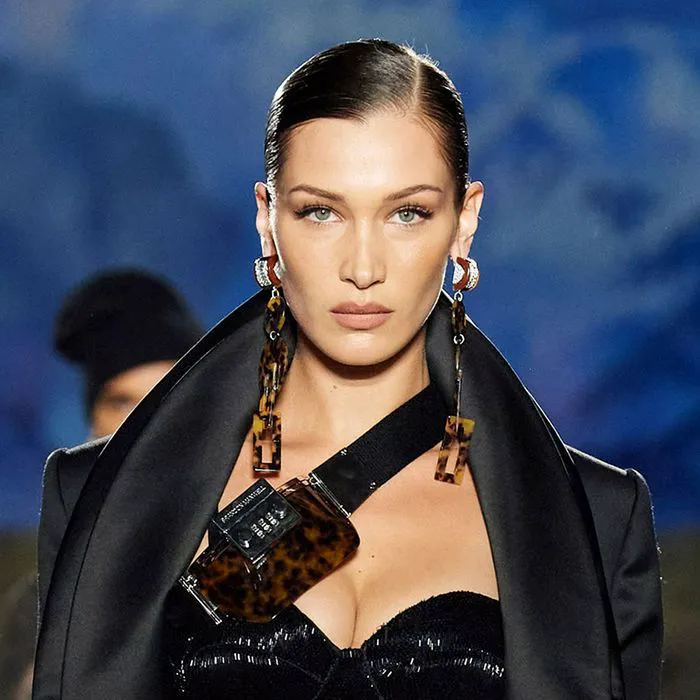 "Bella Hadid in a trendy outfit at a fashion event"