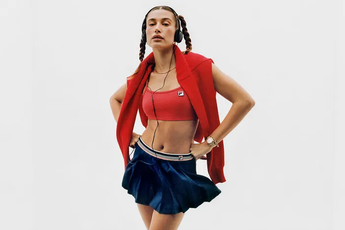 Hailey Bieber Fila spring summer 2023 edit blue tennis skirt red sports bra braided pigtails