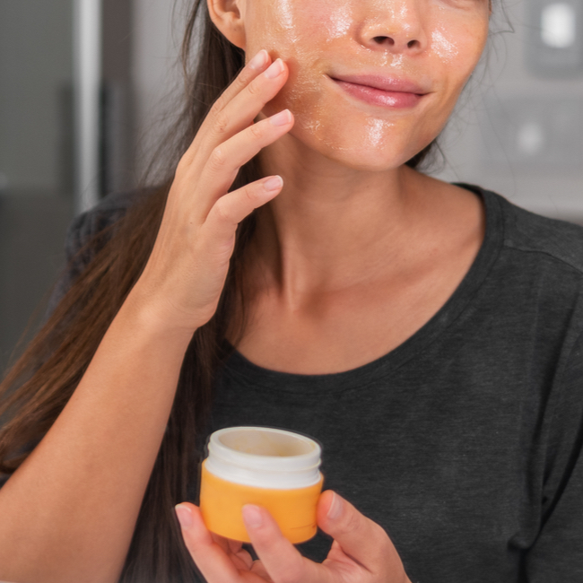 woman-applying-face-mask