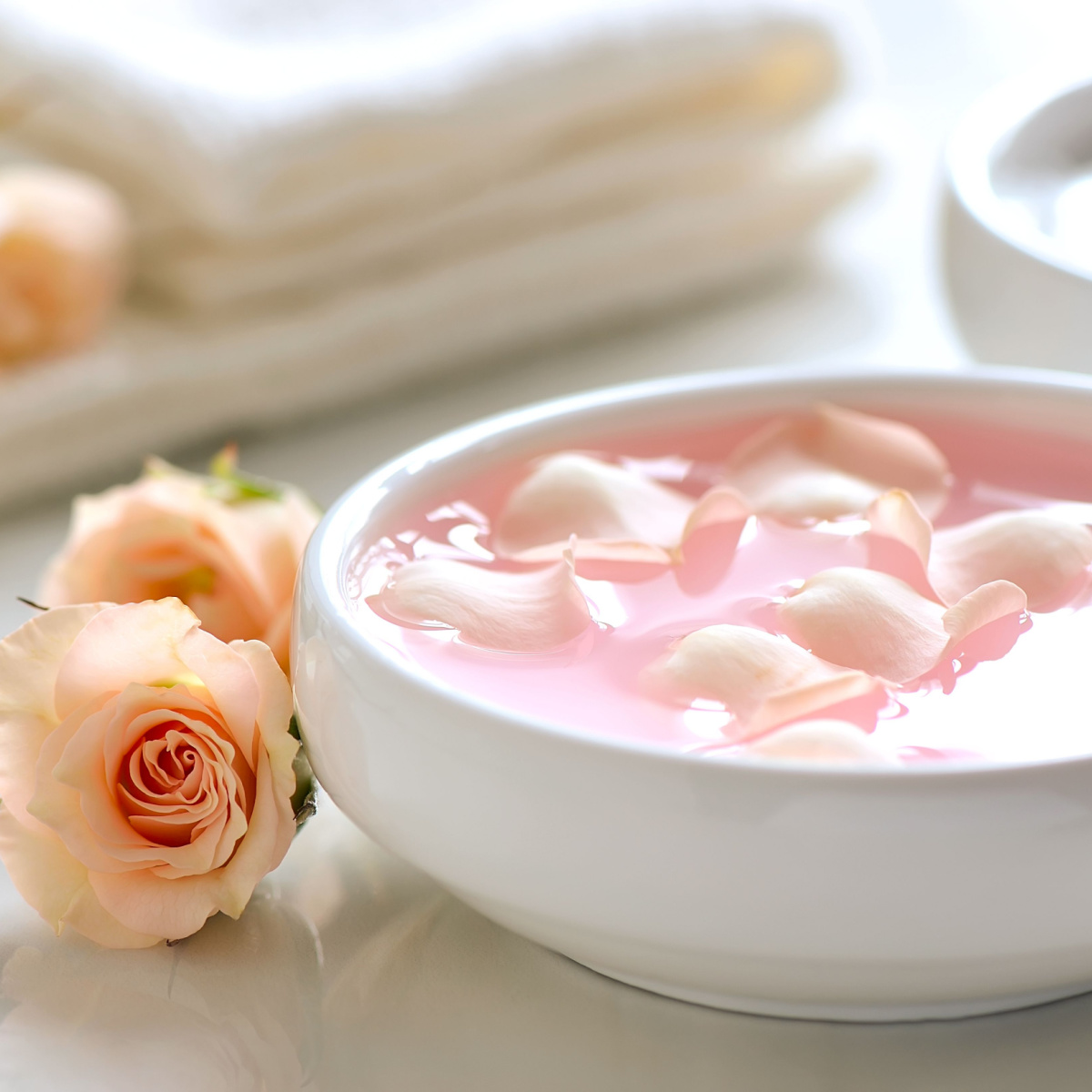 bowl of rose water homemade white dish pink liquid petals