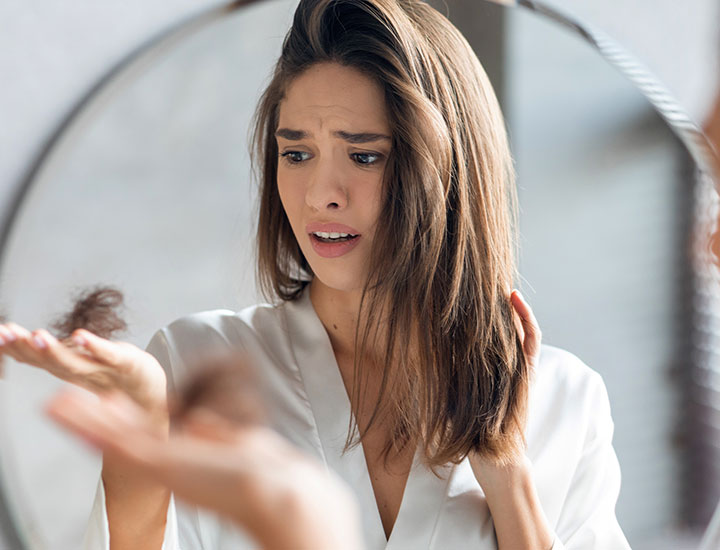 woman-experiencing-hair-loss