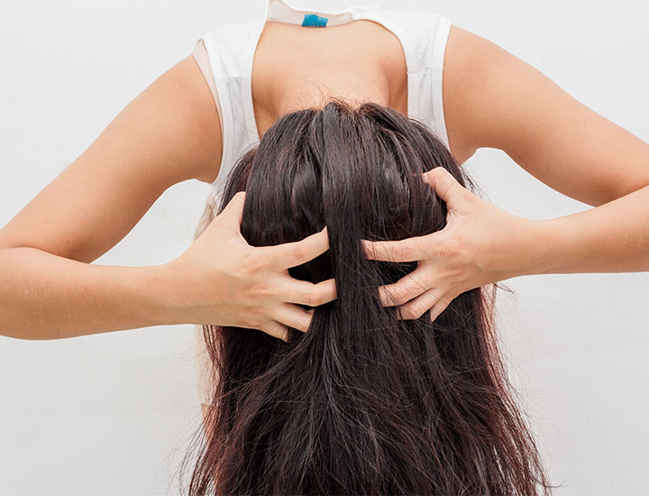 woman-massaging-scalp