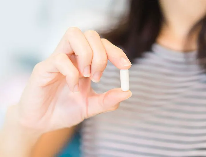 woman-taking-supplement