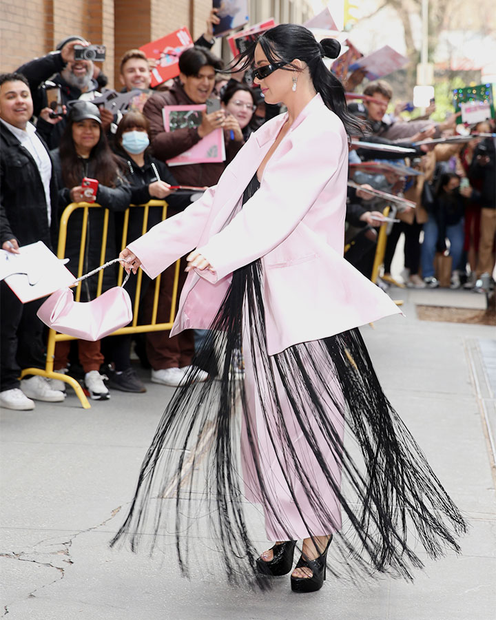 Katy Perry twirling in pink power suit