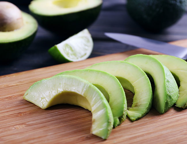 slices of avocado on cutting board