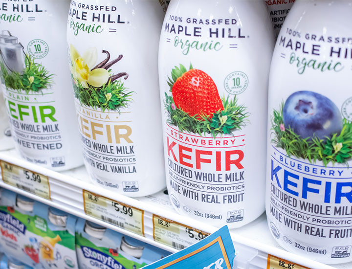 Bottles of whole milk kefir at the grocery store