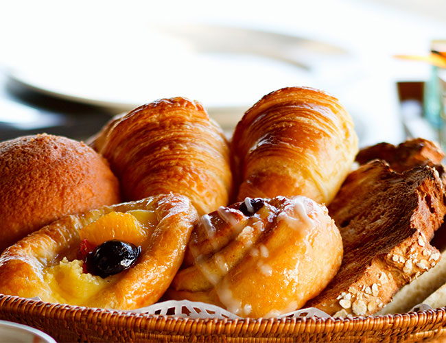 display of breakfast pastries like danishes and croissants
