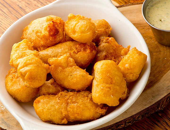 Fried cheese curds in a basket