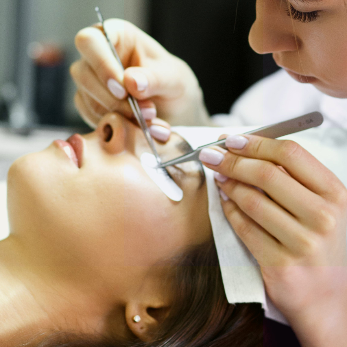 lash extension process beauty salon expert applying false lashes serum