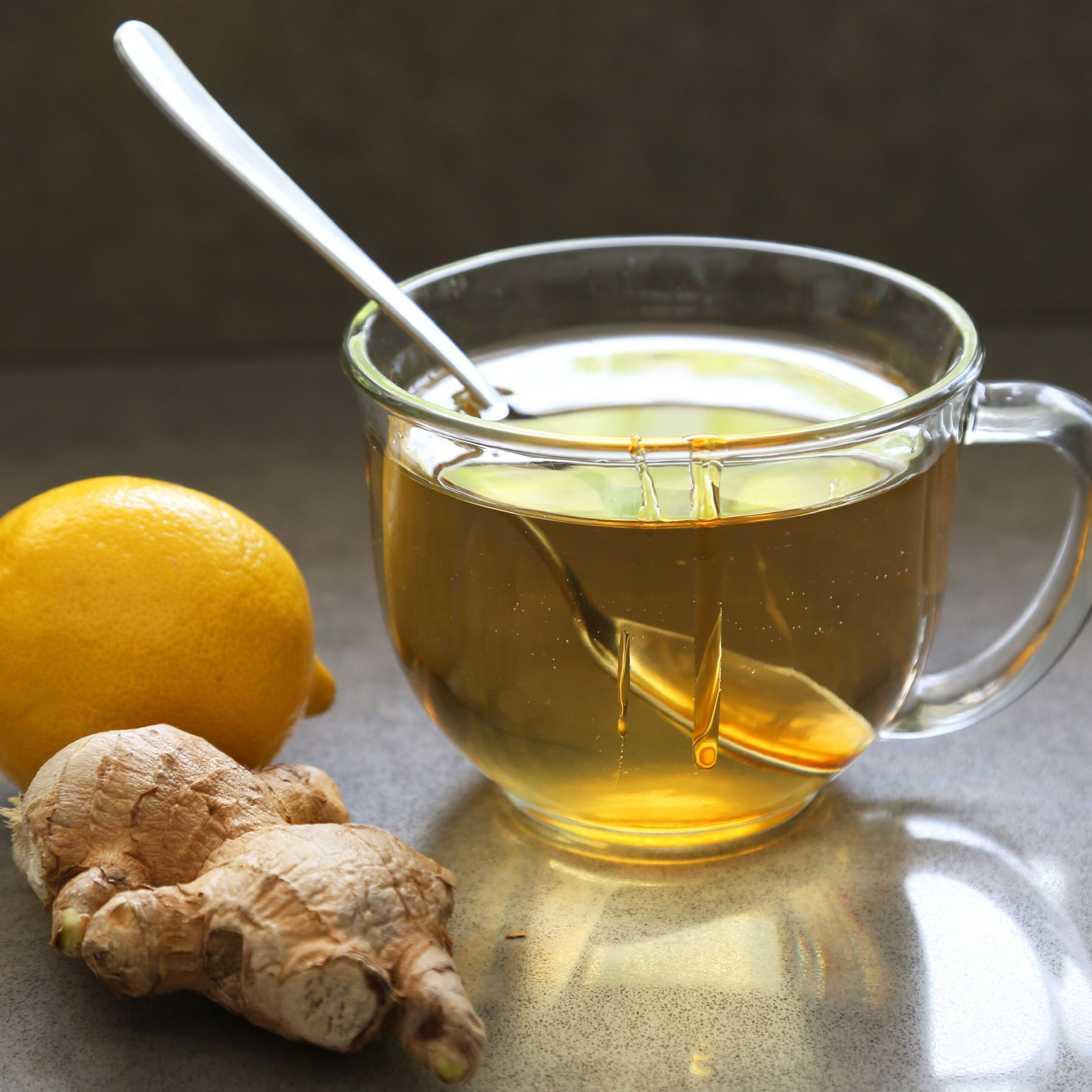 lemon ginger tea in glass teacup