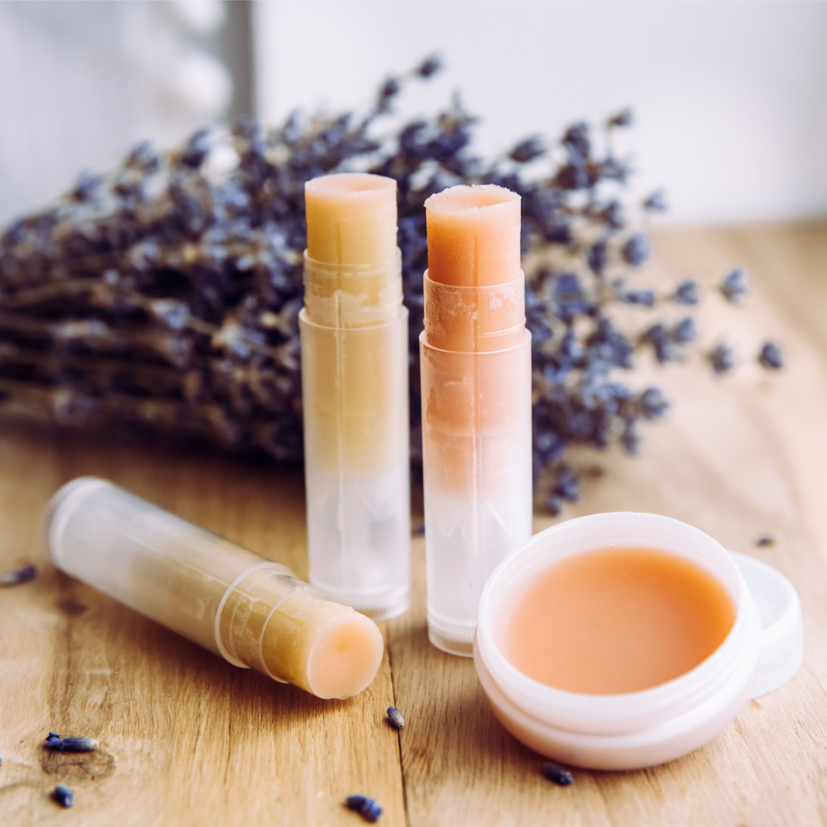 lavender wooden table lip balm sticks lipcare products isolated natural