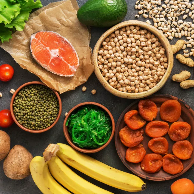 sources of potassium like bananas, fish, dried fruits, and more on display