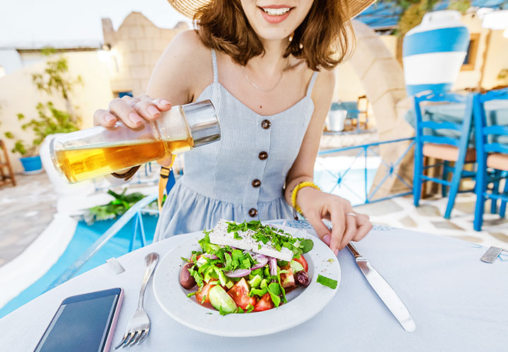 Woman eating a Greek salad
