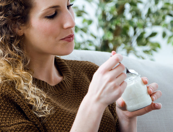 Woman eating yogurt