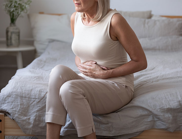 Woman with stomach inflammation pain