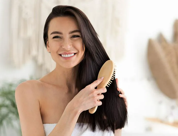 young-woman-brushing-hair