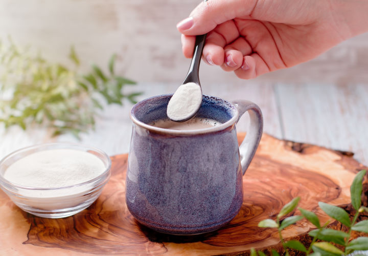 Person stirring protein powder into drink