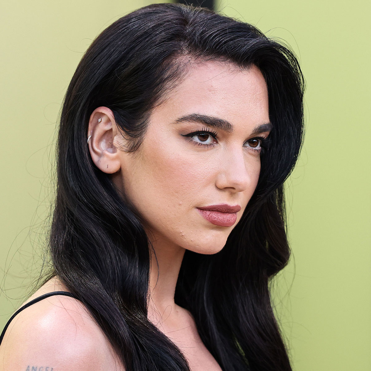 Dua Lipa Is A ‘Versace Goddess’ In A Sequined Halter Top And Micro Mini