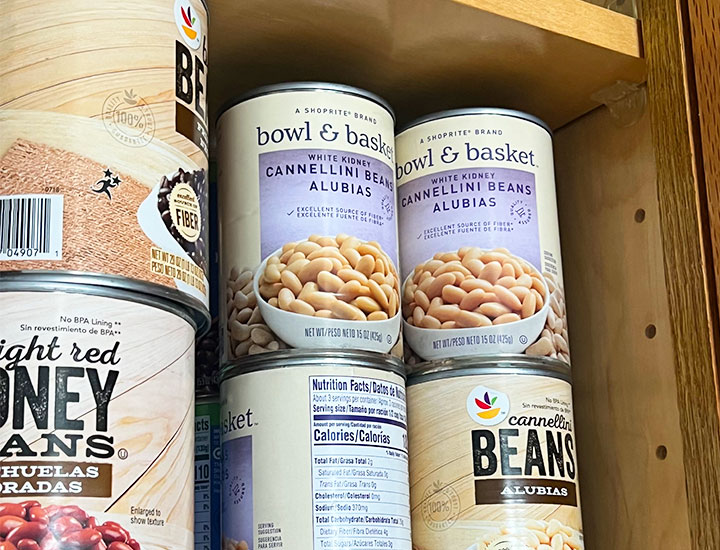 cans of cannelini beans in cabinet