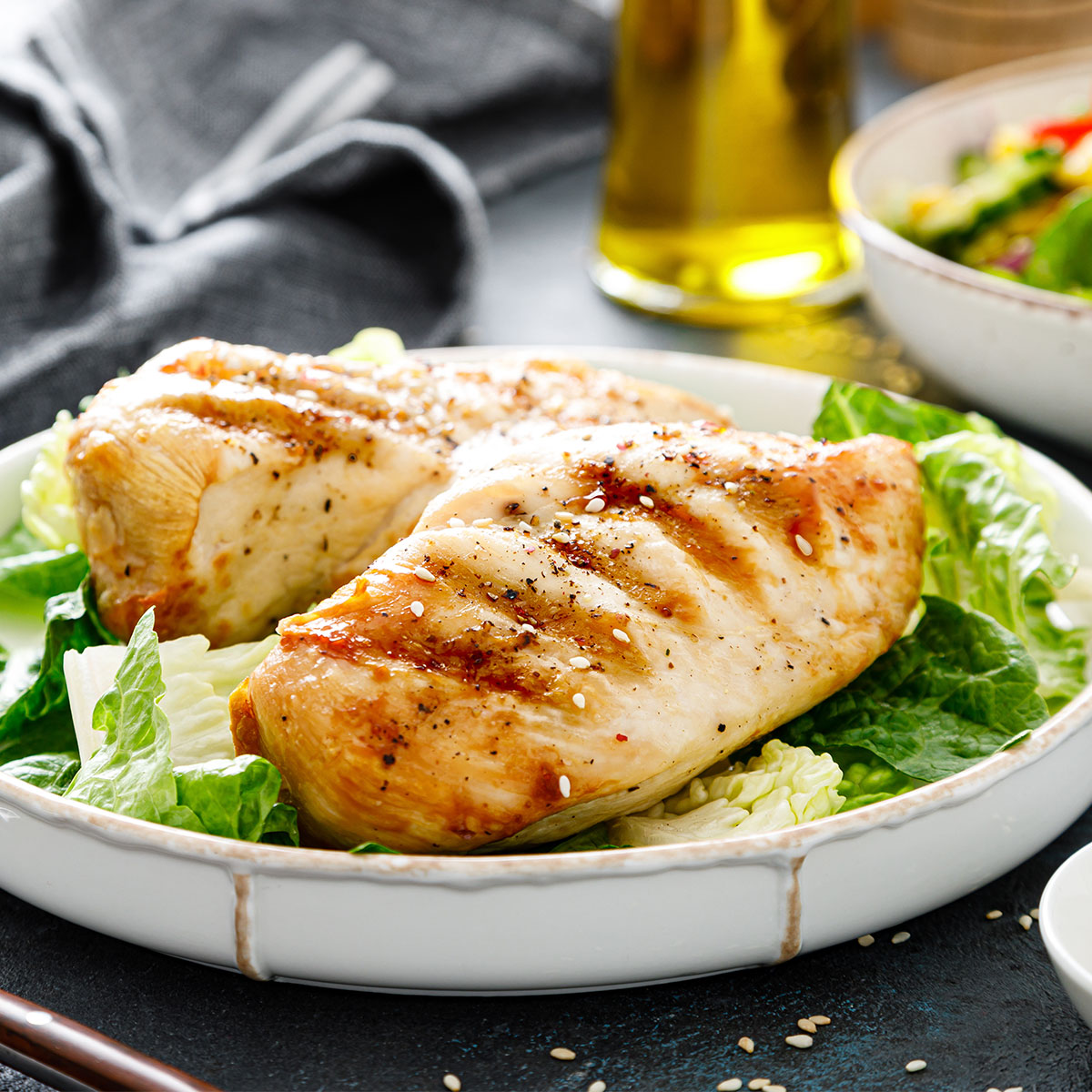 grilled chicken on top of salad