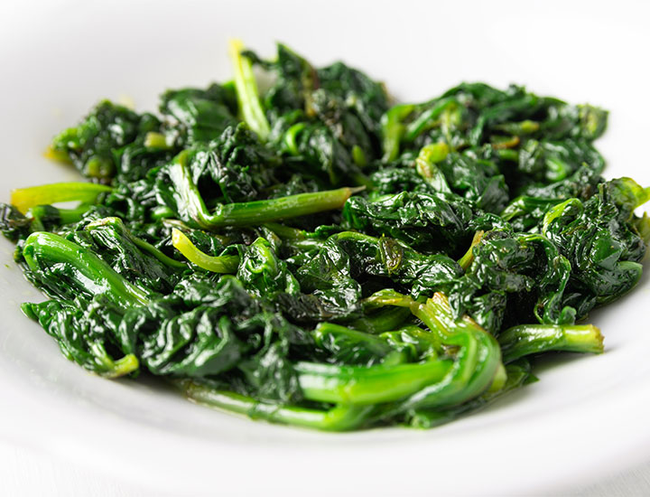 Cooked spinach in a bowl