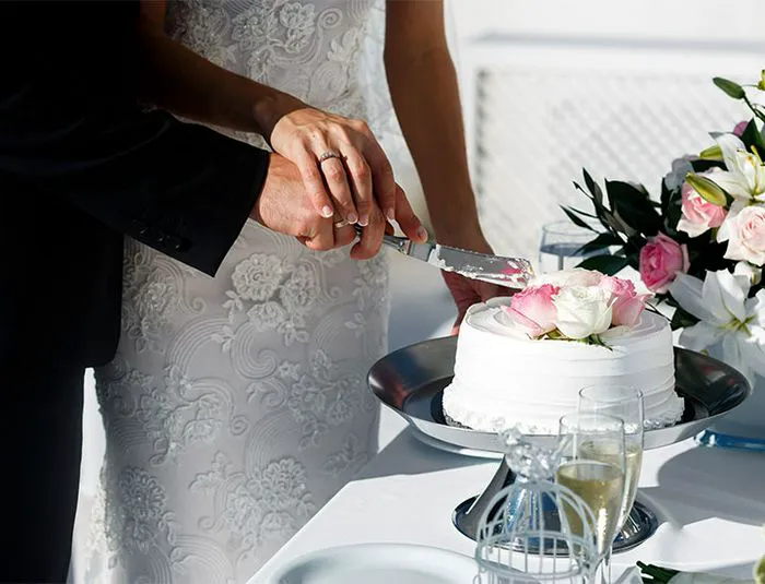 Cake Cutting Couple cutting wedding cake