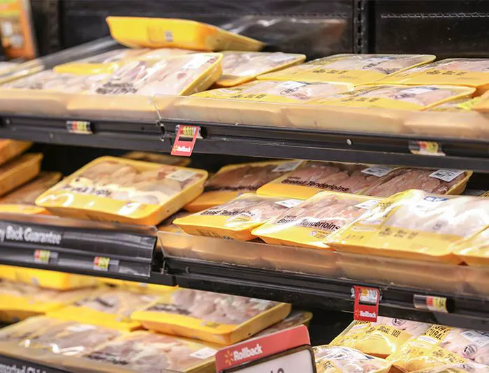 Packaged raw chicken at grocery store
