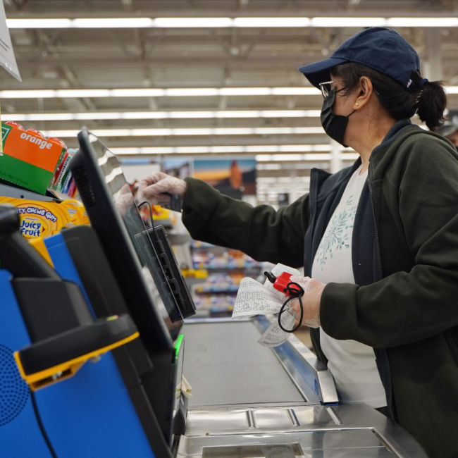 woman at walmart self checkout