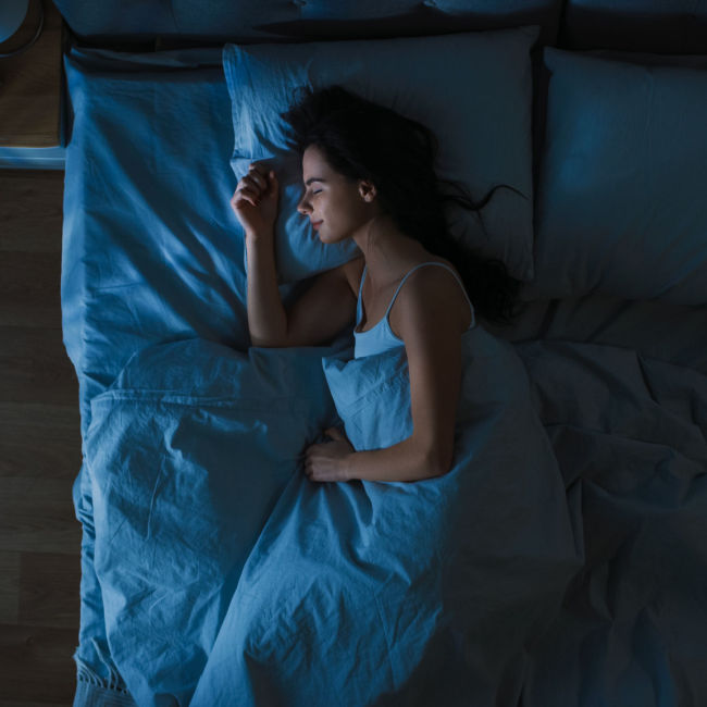 woman sleeping soundly in bed