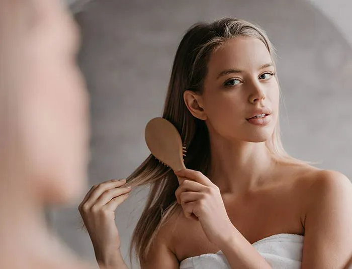 woman-brushing-long-hair