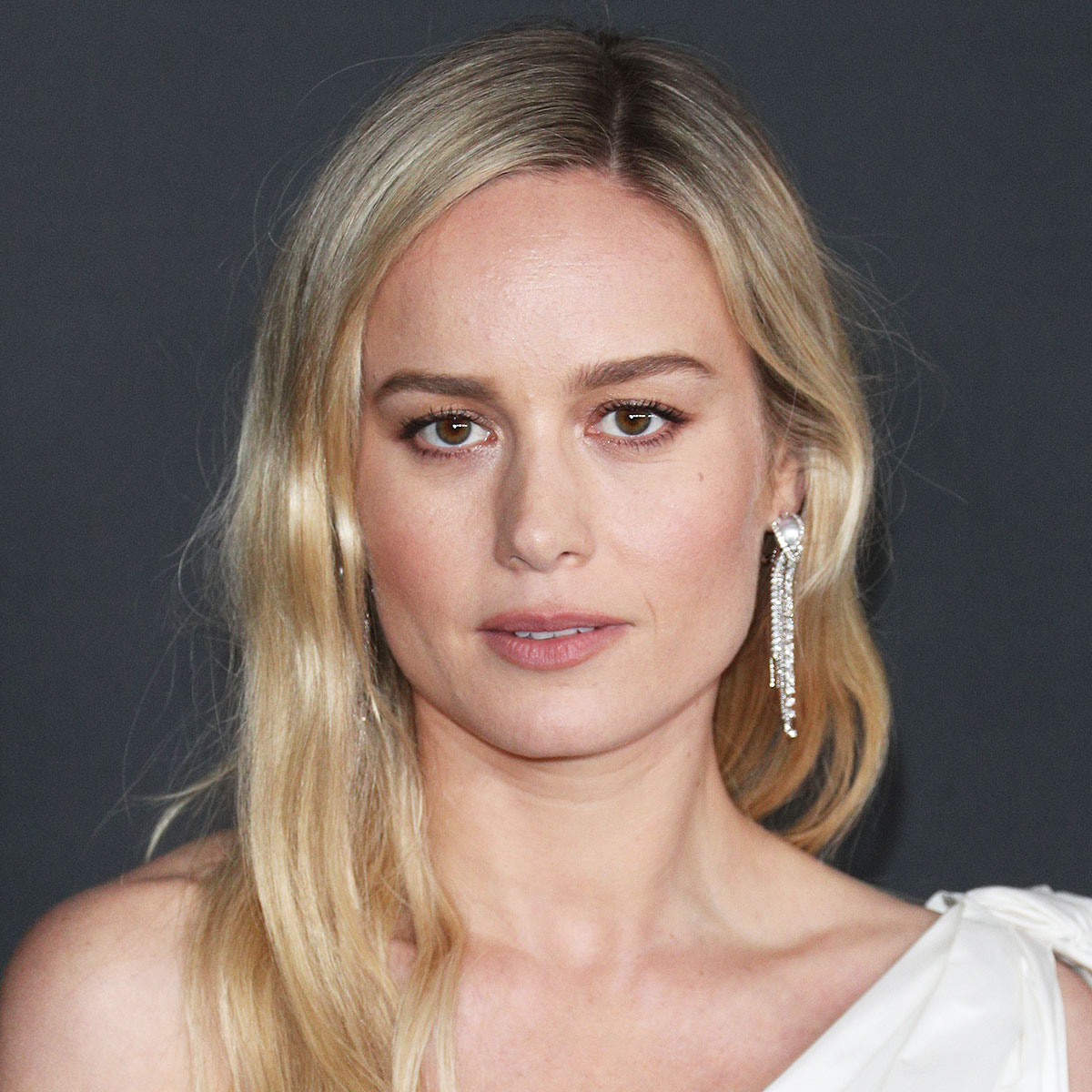 Brie Larson Glows In High-Wasted Jeans, A White Tee, And Chic Leather ...
