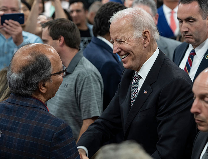 Joe Biden greeting participants at meeting at IBM facility in NY