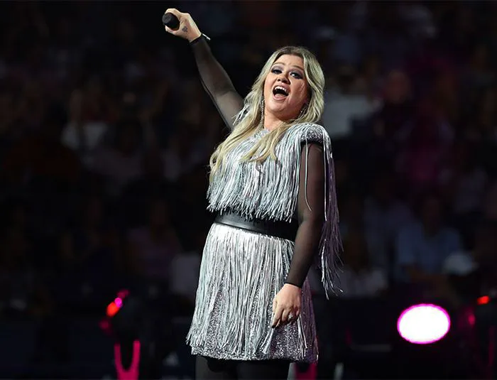 Kelly Clarkson performing on stage