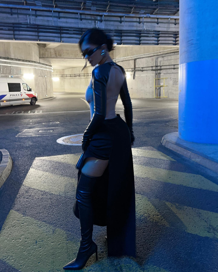 kylie jenner posing parking garage sheer top black maxi skirt