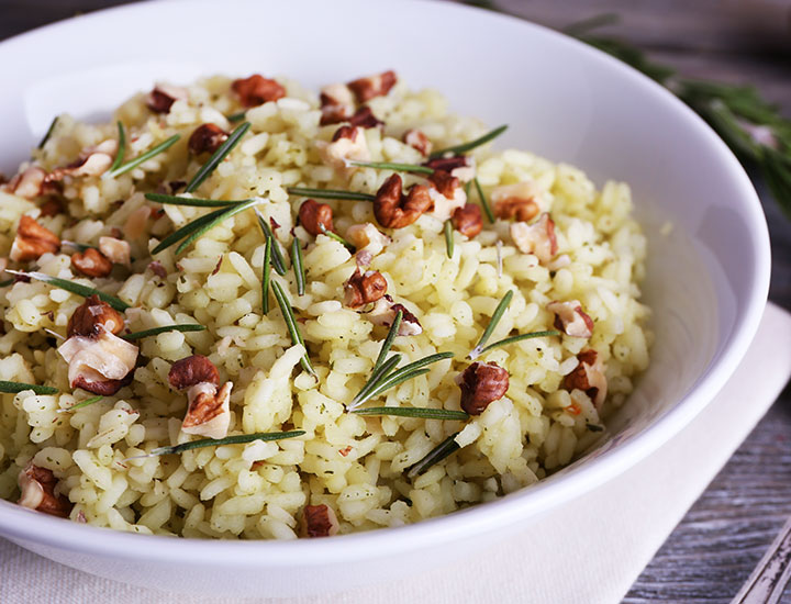 Bowl of rice with walnuts and rosemary