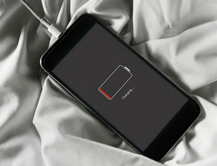 iphone-charging-on-bedsheets