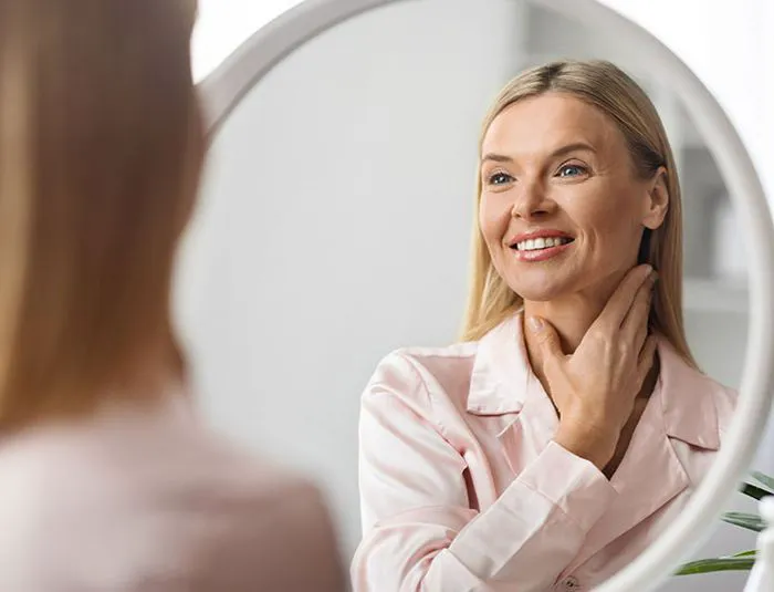 woman-admiring-looks-mirror