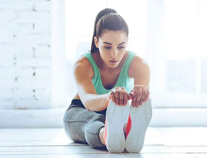 Woman stretching after workout