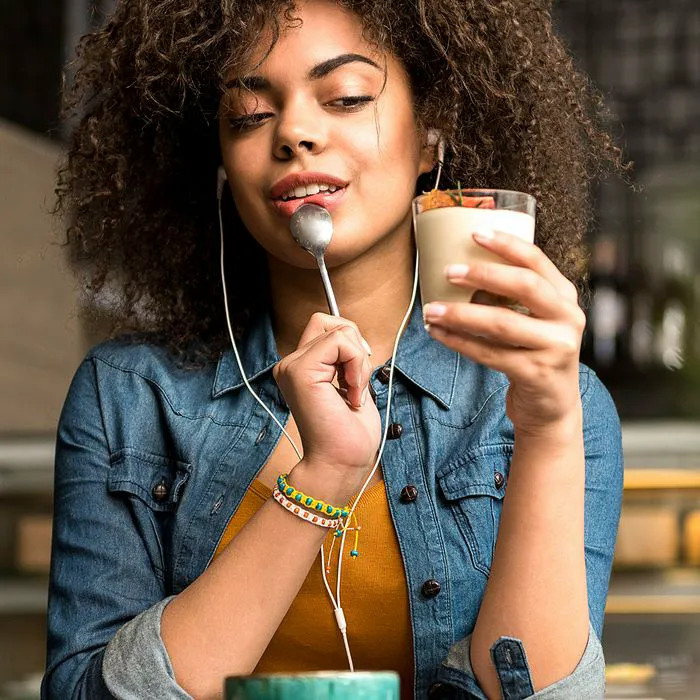 Young woman admiring a tempting dessert treat.