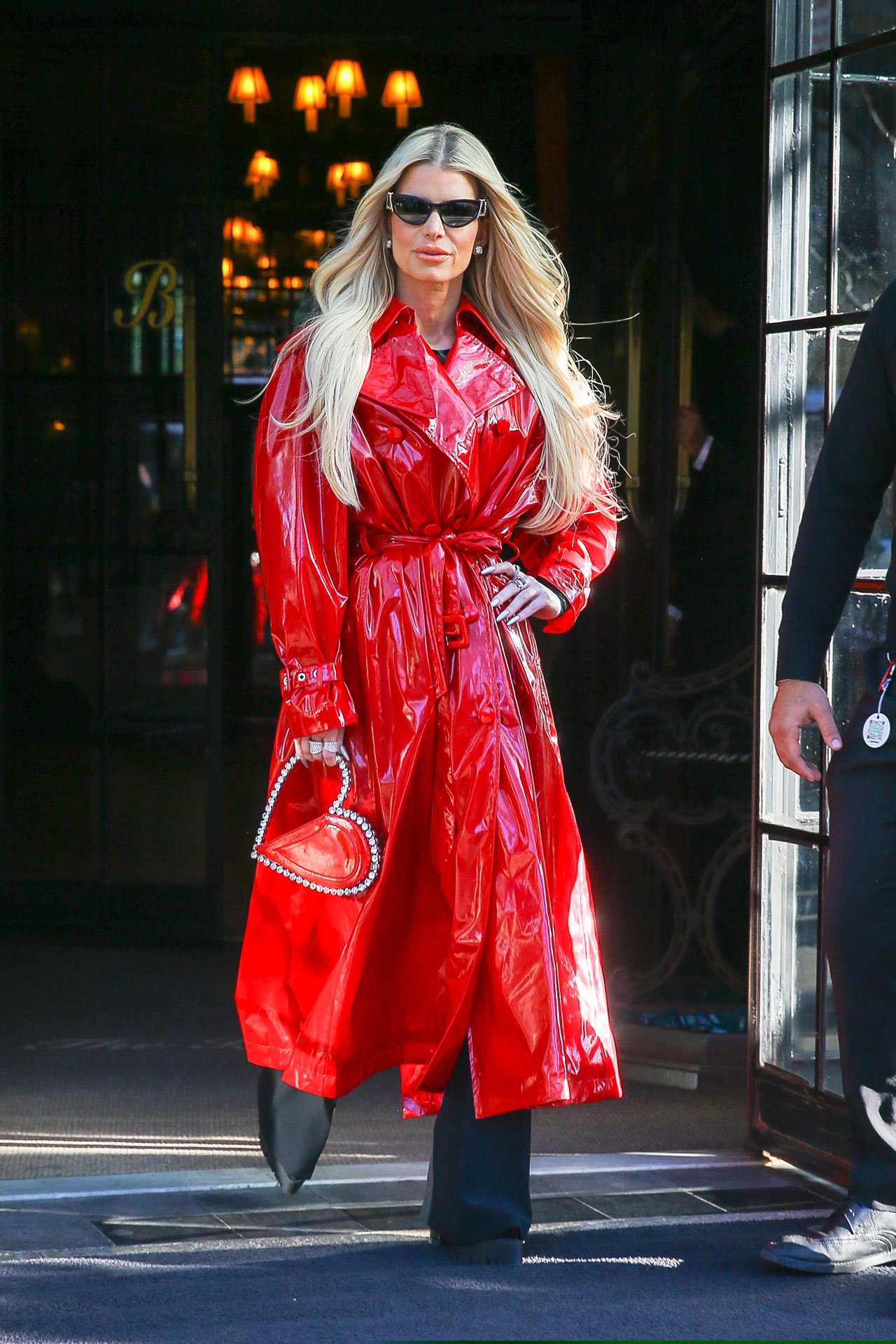 Jessica Simpson red trench coat leaving hotel in New York