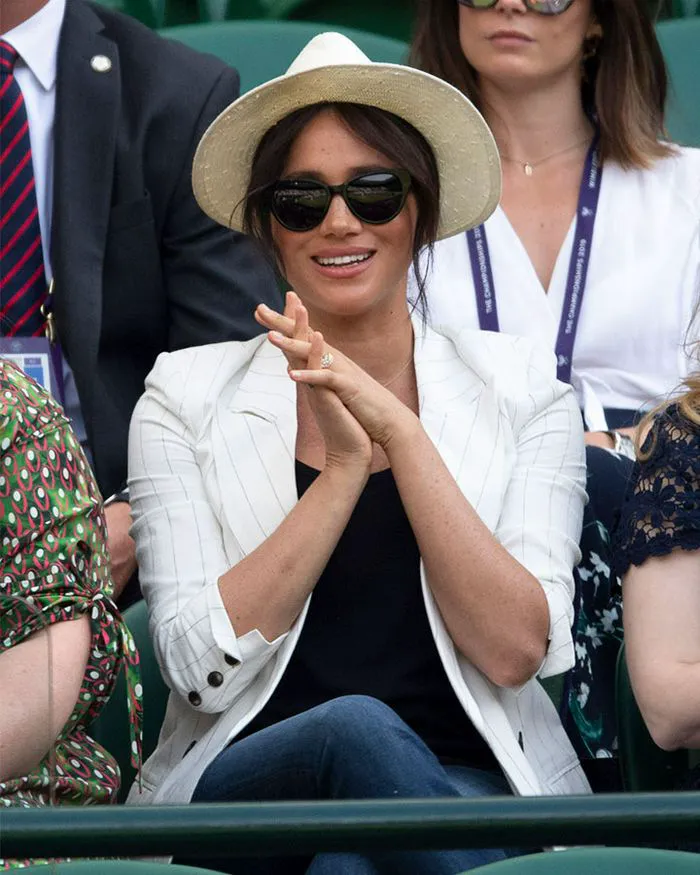 meghan markle straw hat black sunglasses white blazer