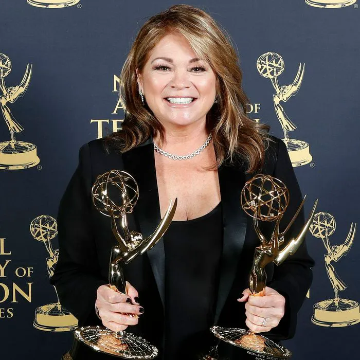 valerie bertinelli holding award trophies red carpet