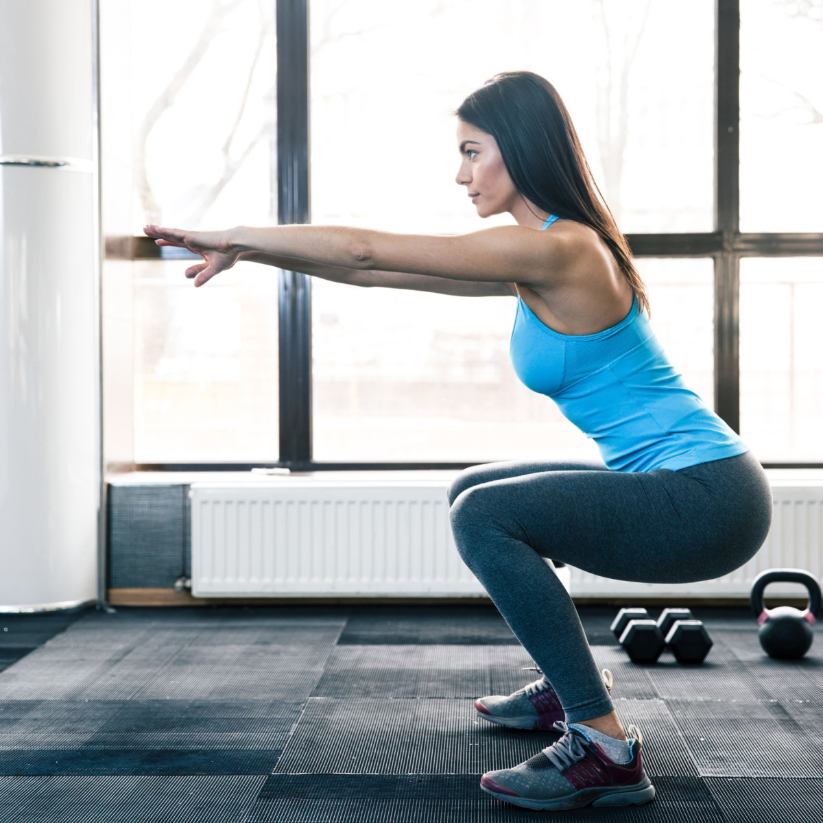 woman performing a squat