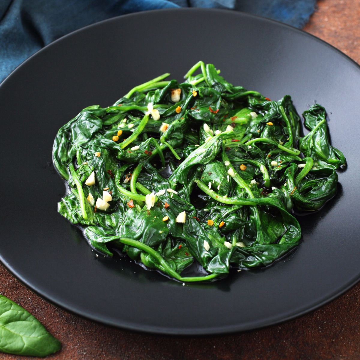 cooked spinach black bowl meal table