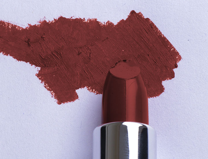 dark brown red lipstick close up smudge