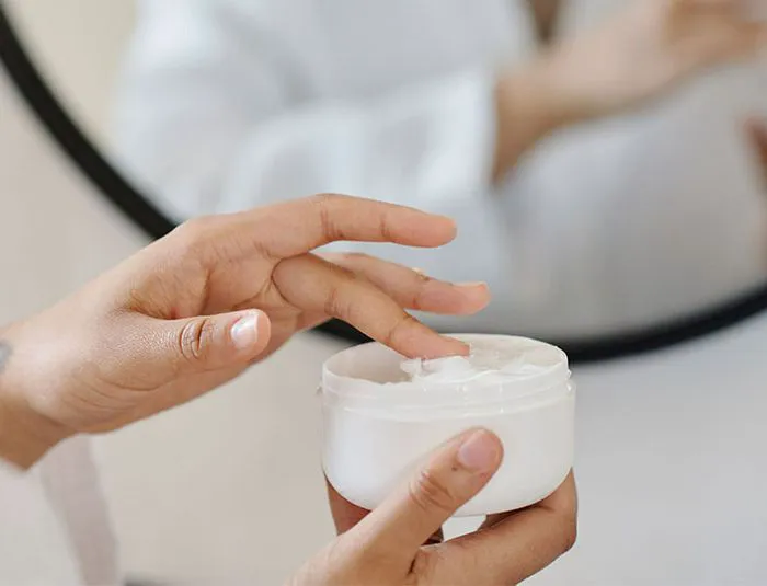 woman-scooping-lotion
