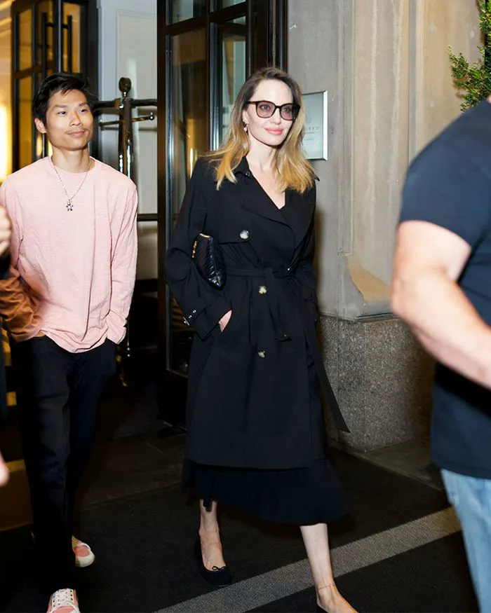 angelina jolie black trench coat belted waist sunglasses blonde hair nyc pax jolie-pitt