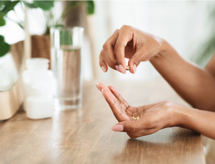 Woman taking a biotin supplement